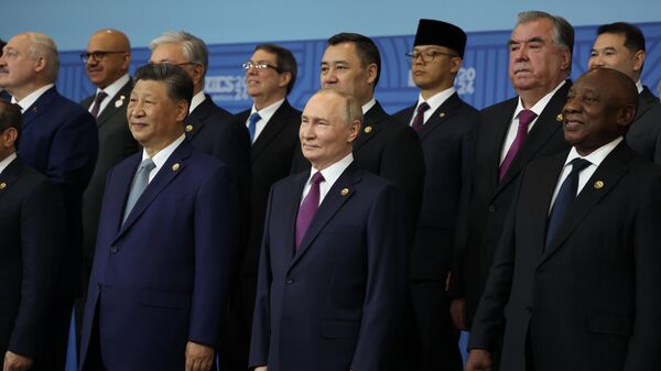 Russian President Vladimir Putin and Chinese President Xi Jinping (left) at a joint photo ceremony of BRICS leaders as part of the 16th BRICS summit in Kazan on October 24, 2024. - Sputnik Africa