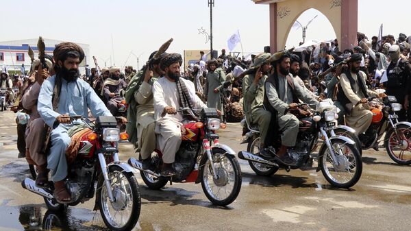 Taliban fighters celebrate the third anniversary of the withdrawal of US-led troops from Afghanistan, in Lashkar Gah, Helmand province, southwestern Afghanistan, Aug. 14, 2024 - Sputnik Africa