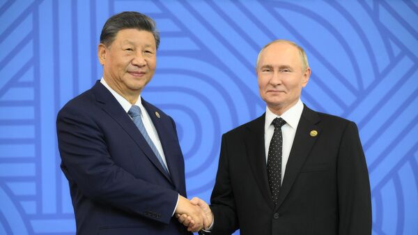 Russian President Vladimir Putin and Chinese President Xi Jinping (left) at the official meeting of the heads of delegations participating in the 16th BRICS summit. - Sputnik Africa