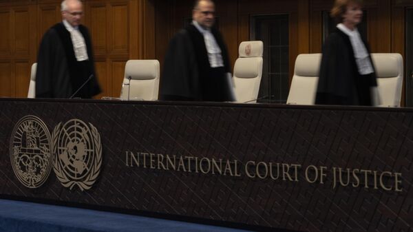 Judges enter the International Court of Justice, or World Court, in The Hague, Netherlands, Friday, May 24, 2024, as the top United Nations court rules on an urgent plea by South Africa for judges to order Israel to halt its military operations in Gaza and withdraw from the enclave. (AP Photo/Peter Dejong) - Sputnik Africa