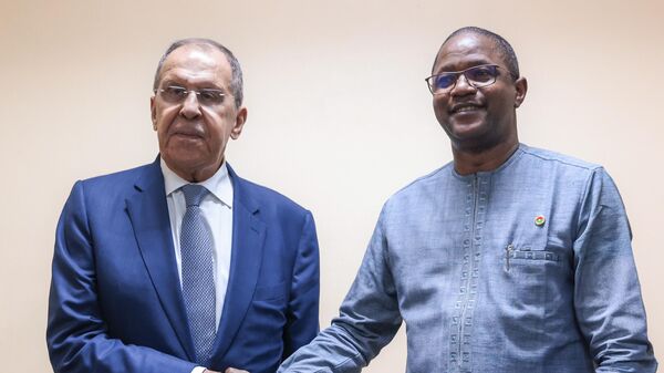 Russian Foreign Minister Sergey Lavrov (left) and Burkina Faso Foreign Minister Jean Marie Traore Karamoko during a meeting. - Sputnik Africa