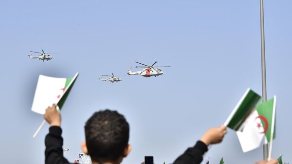 Algerians watch a military parade to mark the 70th anniversary of Algerian war for independence from France, Friday, Nov. 1, 2024 in Algiers, Algeria. - Sputnik Africa