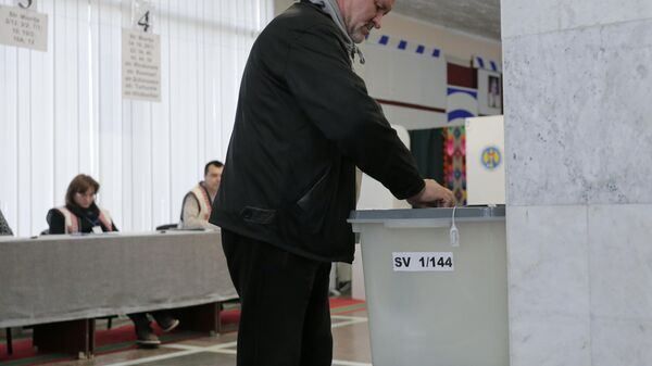 A voter casts a ballot at a polling station during the second round of the presidential election in Chisinau, Moldova, on Sunday, November 3, 2024. - Sputnik Africa