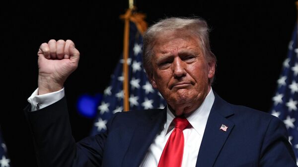 Republican presidential nominee former President Donald Trump gestures after a Tucker Carlson Live Tour show at Desert Diamond Arena, Thursday, Oct. 31, 2024, in Glendale, Ariz.  - Sputnik Africa