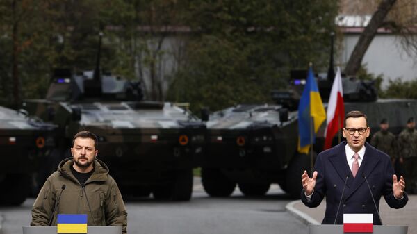 Poland's Prime Minister Mateusz Morawiecki, right, and Ukraine's Volodymyr Zelensky attend a press conference in Warsaw, Poland, Wednesday, April 5, 2023.  - Sputnik Africa