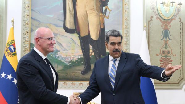 Russian Deputy Prime Minister Dmitry Chernyshenko (left) and President of the Bolivarian Republic of Venezuela Nicolas Maduro during a meeting at the Miraflores Palace in Caracas - Sputnik Africa