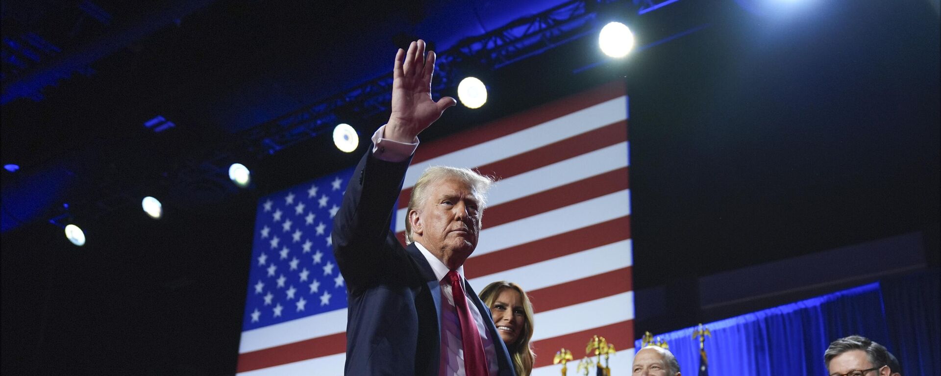 Republican presidential nominee former President Donald Trump waves as he walks with former first lady Melania Trump at an election night watch party at the Palm Beach Convention Center, Wednesday, Nov. 6, 2024, in West Palm Beach, Fla. - Sputnik Africa, 1920, 08.11.2024