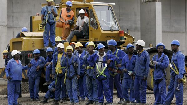Construction workers stand together during a visit by the media and a FIFA delegation to the building site of Durban Stadium, one of the venues for the 2010 World Cup in Durban, South Africa., Saturday, Nov. 24, 2007. - Sputnik Africa