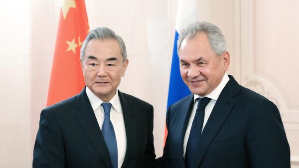 Russian Security Council Secretary Sergei Shoigu and Chinese Foreign Minister Wang Yi. File photo - Sputnik Afrique