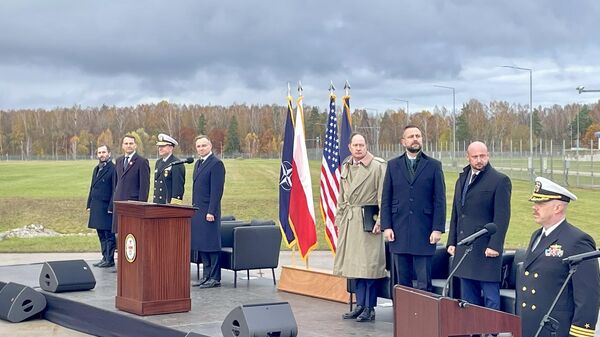 Le Président polonais Andrzej Duda lors de la mise en service d'un système Aegis Ashore à Redzikowo, à 165 km de la frontière avec la Russie. - Sputnik Afrique