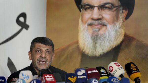 Hezbollah's chief spokesman Mohammed Afif speaks during a press conference in Dahiyeh, in the southern suburb of Beirut, Lebanon, Monday, Nov. 11, 2024.  - Sputnik Africa