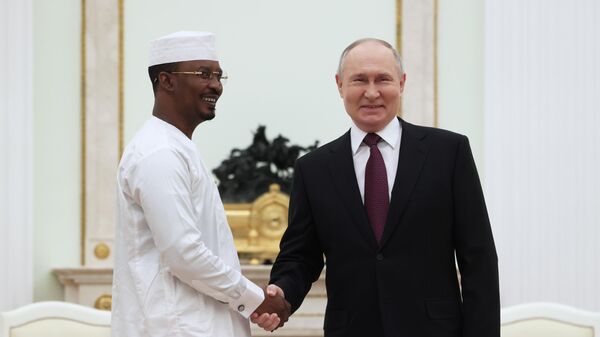 Russian President Vladimir Putin and interim President of Chad Mahamat Idriss Deby shake hands as they attend a meeting at the Kremlin in Moscow, Russia, on January 24, 2024. - Sputnik Africa