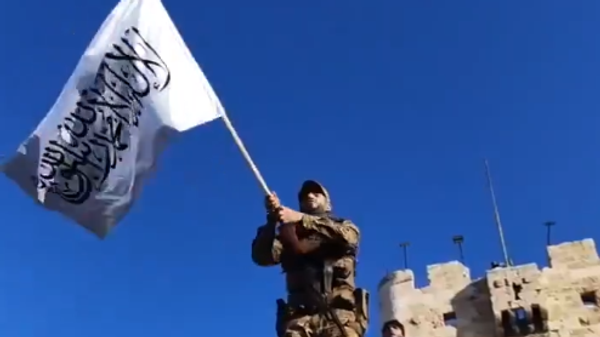 Terrorist militant poses near Aleppo's UNESCO World Heritage Site Citadel during jihadist advance on the city. - Sputnik Africa