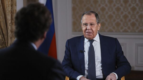 In this photo released by the press service of the Russian ministry of foreign Affairs, the minister of foreign Affairs of russia Sergey Lavrov speaks during an interview with the former presenter of Fox News ' Tucker Carlson, back to camera, in Moscow, Russia, Tuesday, December 3, 2024. (Press Service of the Russian ministry of foreign Affairs via AP) - Sputnik Africa