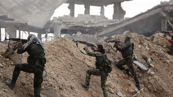 In this Dec. 5, 2016 file photo, Syrian army soldiers fire their weapons during a battle with rebel fighters at the Ramouseh front line, east of Aleppo, Syria. - Sputnik Africa