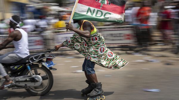 Supporters of opposition candidate and former President John Dramani Mahama celebrate his victory after his opponent conceded in Accra, Ghana, Sunday, Dec. 8, 2024. - Sputnik Africa