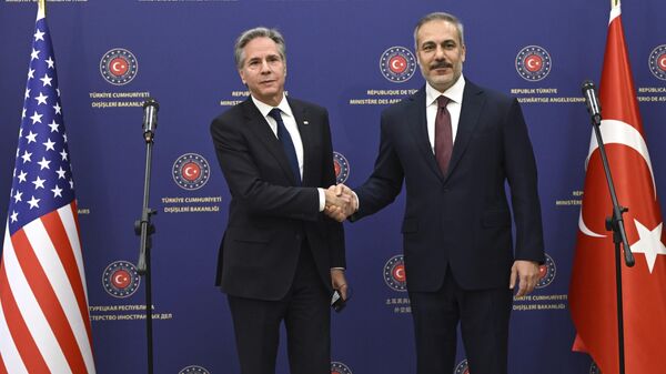 US Secretary of State Antony Blinken, left, shakes the hand of Turkish Foreign Minister Hakan Fidan after a joint press conference at the Ministry headquarters in the Turkish capital Ankara Friday, Dec. 13, 2024.  - Sputnik Africa