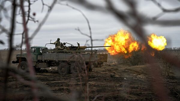 Russian servicemen fire an AZP S-60 anti-aircraft gun mounted on a Kamaz vehicle at Ukrainian positions in the Krasny Liman area. - Sputnik Africa