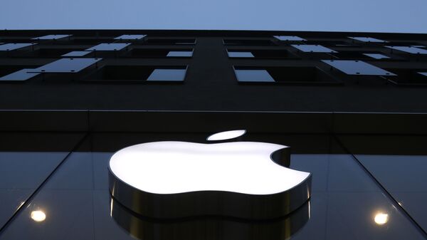 The logo of Apple is illuminated at a store in the city center in Munich, Germany, Wednesday, Dec. 16, 2020. - Sputnik Africa