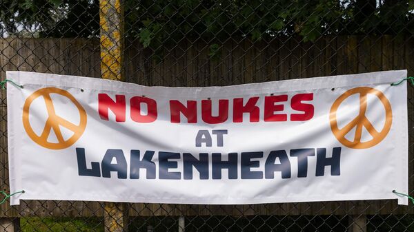 A banner hung by a supporter of the Campaign for Nuclear Disarmament (CND) on the perimeter fence of RAF Lakenheath is pictured during a protest there on 11th May 2024 in Lakenheath, United Kingdom.  - Sputnik Africa