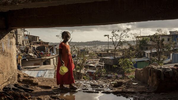 A young girl walks in the Kaweni slum on the outskirts of Mamoudzou, in the French Indian Ocean island of Mayotte, Thursday, Dec. 19, 2024, after Cyclone Chido.  - Sputnik Africa