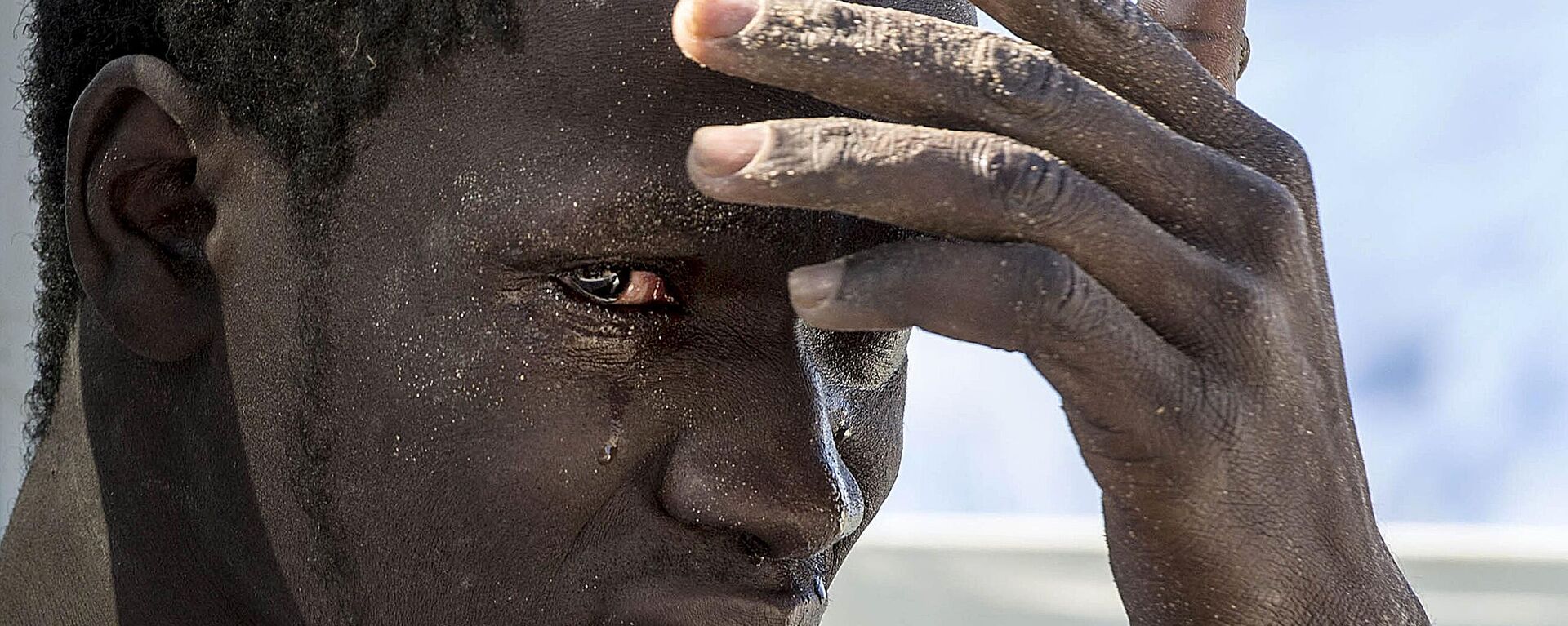 A file photo dates March 13, 2015 shows An illegal migrant reacts at the coast of Souq al Jum'aa region in Tripoli, Libya after they got captured. - Sputnik Africa, 1920, 19.12.2024