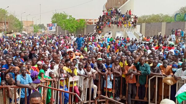 People gather to stage a demonstration for the repeal of the military agreement, allows military and civilian personnel of the US Department of Defense to serve in the country, upon the call of civil society organizations in front of the National Assembly building in Niamey, Niger on April 13, 2024.  - Sputnik Africa