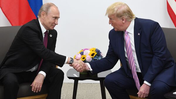 Russian President Vladimir Putin and US President Donald Trump shake hands during a bilateral meeting at the at the Group of 20 (G20) leaders summit in Osaka, Japan. - Sputnik Africa