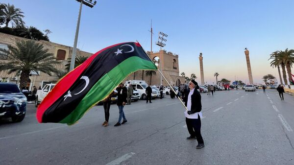 People gather at the Martyrs' Square to celebrate the 70th Independence Anniversary of Libya in Tripoli, Libya on December 24, 2021 - Sputnik Africa