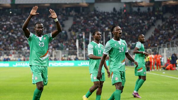 Nigerien players celebrate after scoring during the Group F match between Algeria and Niger during the 2023 Africa Cup of Nations qualifiers in Algiers, Algeria, March 23, 2023 - Sputnik Africa