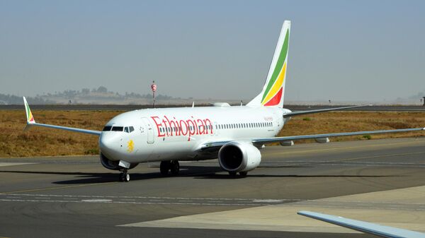 Addis Ababa, Ethiopia: Ethiopian Airlines ET-AVI (Boeing 737 NG / Max - MSN 62448), twin of the Ethiopian 737 MAX ET-AVJ that crashed on 10 March 2019 (Flight 302) - taxiing at Addis Ababa Bole International Airport - Sputnik Africa