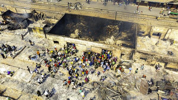 The devastating aftermath of a fire at the Kantamanto market in Ghana. - Sputnik Africa