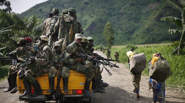 In this Nov. 30, 2012 file photo, M23 rebels withdraw from the Masisi and Sake areas in eastern Congo.  - Sputnik Africa