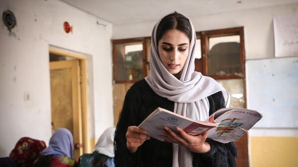 Afghan volunteer sisters, Sodabe Nezend (21) and Azita Nezend (23) educate Afghan girls of middle and high school ages who are not allowed to have an education, child workers, and illiterate women at the school that they established through their own means in Kabul, Afghanistan on October 31, 2022. - Sputnik Africa