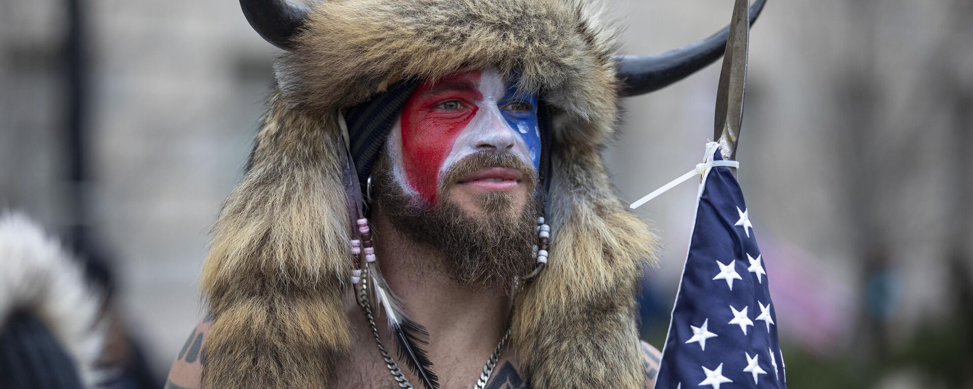 WASHINGTON, DC - JANUARY 06: Jacob Chansley, a.k.a. Jake Angeli and the QAnon Shaman, speaks to passersby during the Stop the Steal rally on January 06, 2021 in Washington, DC. - Sputnik Africa, 1920, 06.01.2025