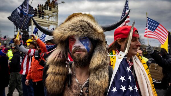 Jacob Anthony Angeli Chansley, known as the QAnon Shaman, is seen at the Capital riots. - Sputnik Africa