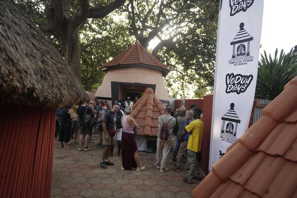 Tourists wait to enter the Temple of Pythons, Ouidah, Benin, Jan. 9, 2025. - Sputnik Africa