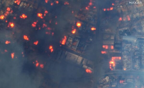 Maxar DURING satellite image of homes and a neighborhood on fire along Alltadena Drive in Altadena, California. - Sputnik Africa