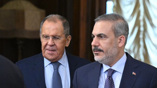 Russian Foreign Minister Sergey Lavrov and Turkish Foreign Minister Hakan Fidan hold a meeting in Moscow. File photo. - Sputnik Africa