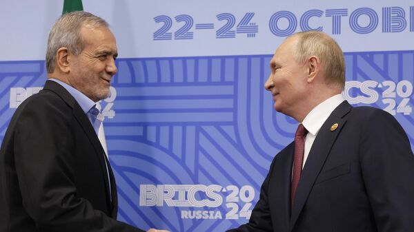 Russian President Vladimir Putin, right, and Iranian President Masoud Pezeshkian shake hands during their meeting on the sidelines of the BRICS summit in Kazan, Russia, Wednesday, Oct. 23, 2024. - Sputnik Africa