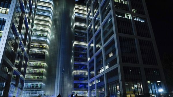 People walk outside a building on The Kirya, which houses Israel's Ministry of Defense, Monday, Oct. 16, 2023, in Tel Aviv.  - Sputnik Africa