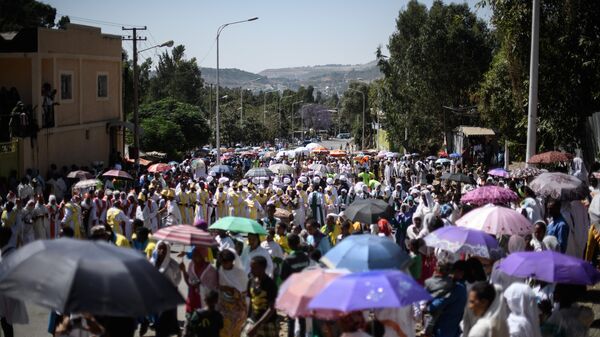 Worshippers and Ethiopian Orthodox priests take part in a procession to mark the end of the annual Timkat Epiphany celebration on January 19, 2017 in Gondar, Ethiopia. - Sputnik Africa