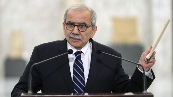 Lebanese Prime Minister-designate Nawaf Salam holds up a copy of the Lebanese Constitution as he speaks to journalists after his meeting with Lebanese President Joseph Aoun at the presidential palace in Baabda, east of Beirut, Lebanon, Tuesday, Jan. 14, 2025.  - Sputnik Africa