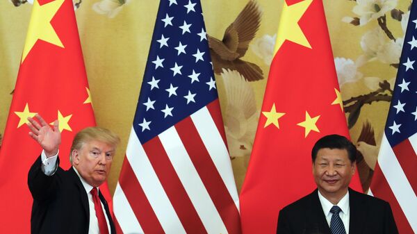 Nov. 9, 2017, file photo, US President Donald Trump waves next to Chinese President Xi Jinping after attending a joint news conference at the Great Hall of the People, in Beijing. - Sputnik Africa