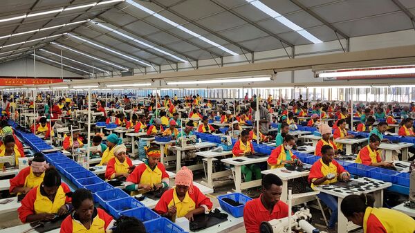 Ethiopian factory workers produce shoes at the Chinese company Huajian's plant in the Lebu Industrial complex near Addis Ababa, Ethiopia. - Sputnik Africa