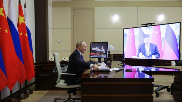 Russian President Vladimir Putin holds talks with Chinese President Xi Jinping via videoconference. - Sputnik Africa