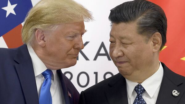 In this Saturday, June 29, 2019, file photo, US President Donald Trump, left, meets with Chinese President Xi Jinping during a meeting on the sidelines of the G-20 summit in Osaka, Japan. - Sputnik Africa