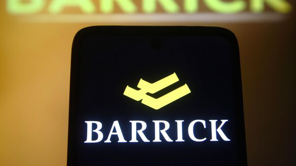 In this photo illustration, a Barrick Gold Corporation logo is seen on a smartphone and a computer screen and on the background.  - Sputnik Africa