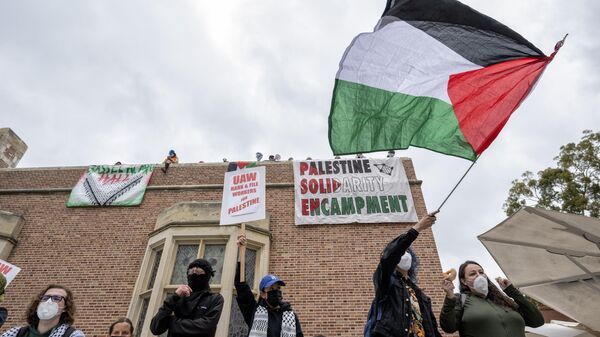 Pro-Palestinian protesters occupy Kerckhoff Hall on the campus of UCLA in Los Angeles on Thursday, May 23, 2024.  - Sputnik Africa