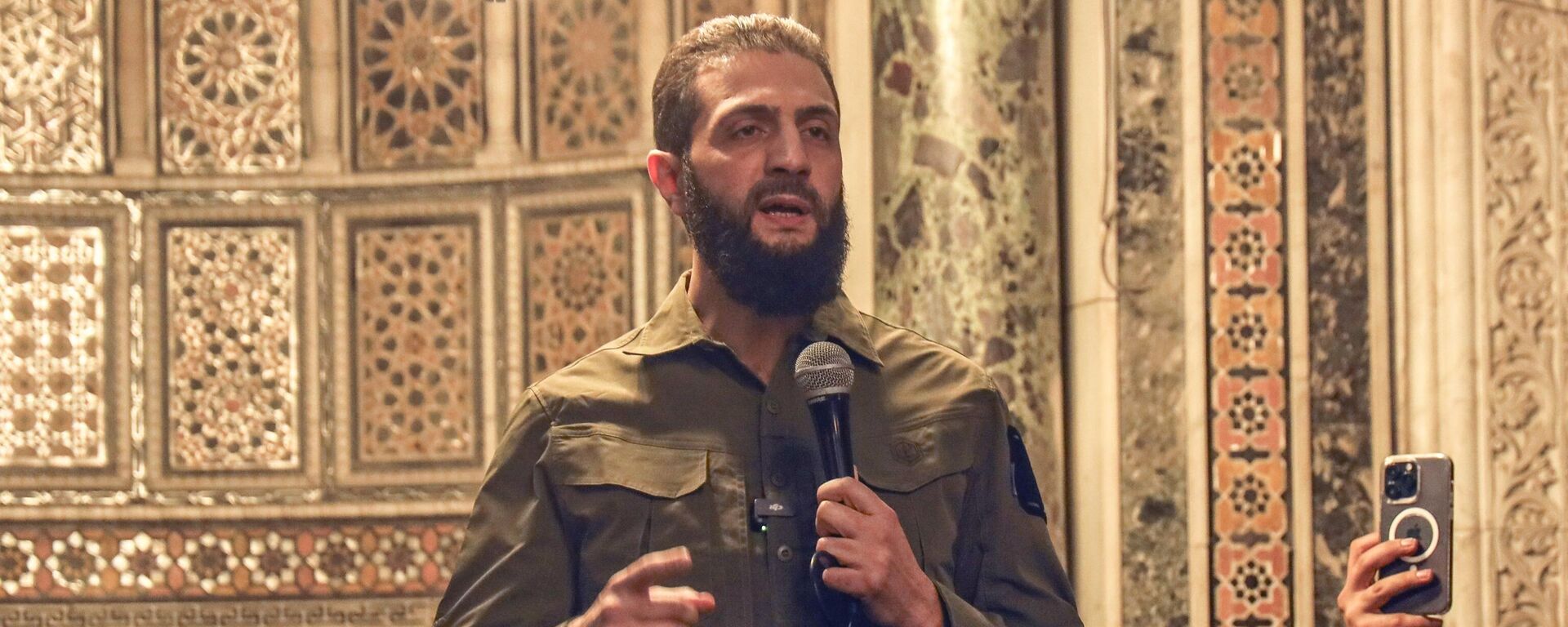 Syria's interim President Ahmed al-Sharaa, also known by nom de guerre Abu Mohammed al-Golani, speaks at the Umayyad Mosque in Damascus, Syria, Sunday, Dec. 8, 2024. - Sputnik Africa, 1920, 04.02.2025